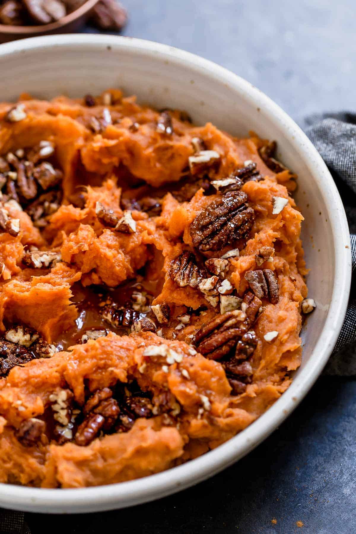 Close view of Maple Mashed Sweet Potatoes in a white bowl