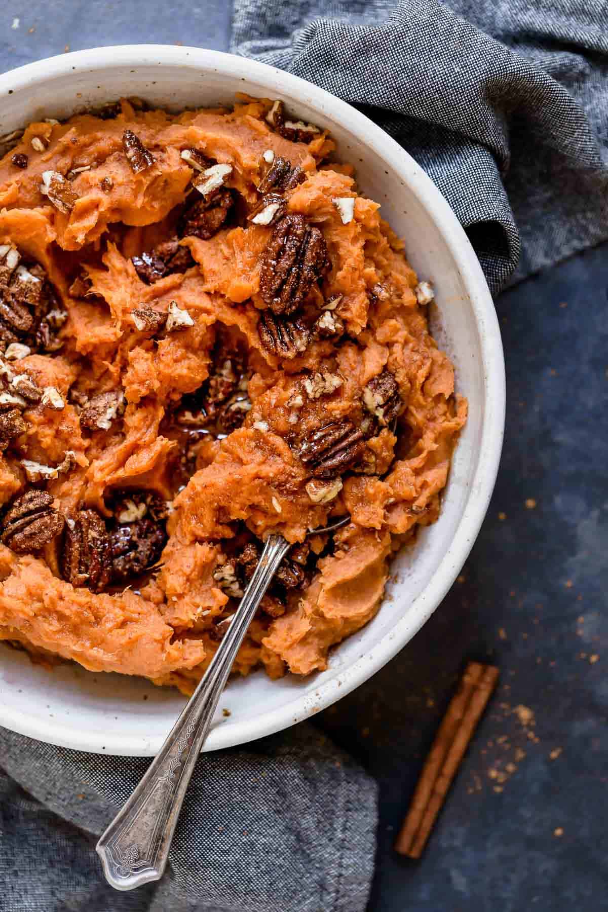 Overhead view of Maple Mashed Sweet Potatoes in a white bowl 