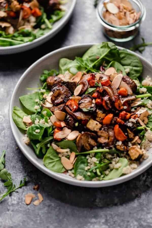 Balsamic Roasted Vegetable with Quinoa Salad over greens and topped with toasted almonds.