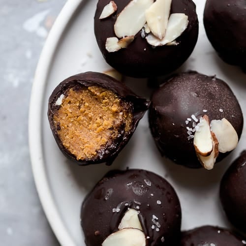 A plate of Pumpkin Pie Truffles topped with sliced almonds