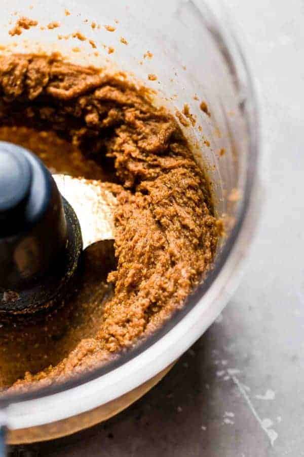 Close up view of the ingredients for Pumpkin Pie Truffles mixed in a blender