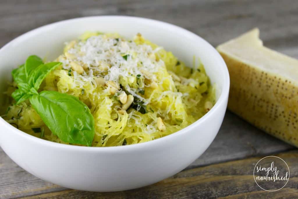 Spaghetti Squash with Garlic and Herbs | Tender strands of roasted spaghetti squash are tossed with olive oil, fresh herbs and toasted pine nuts for a simple yet satisfying dish. | whole30 recipes | gluten-free dinners | dairy-free dinners | vegan dinners || The Real Food Dietitians #whole30dinner #spaghettisquash