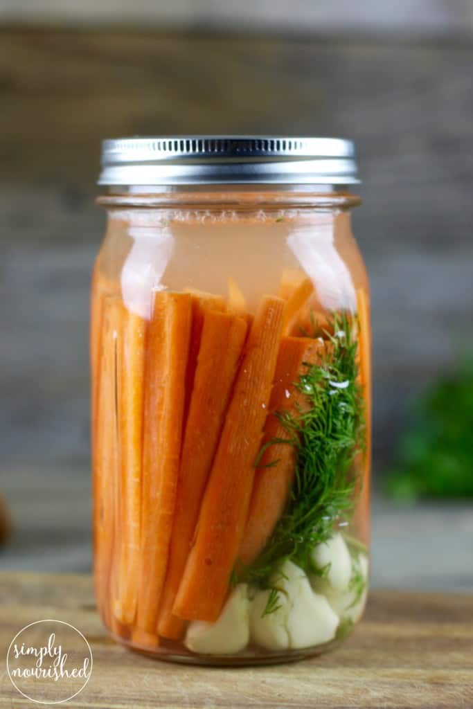Fermented Carrots with Dill | Fermenting foods is an ancient method of preservation and also provides a host of nutritional benefits. Boost your immune system and gut health with this Simple recipe | http://simplynourishedrecipes.com/fermented-carrots-with-dill/