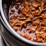 Shredded chicken taco meat in a slow cooker