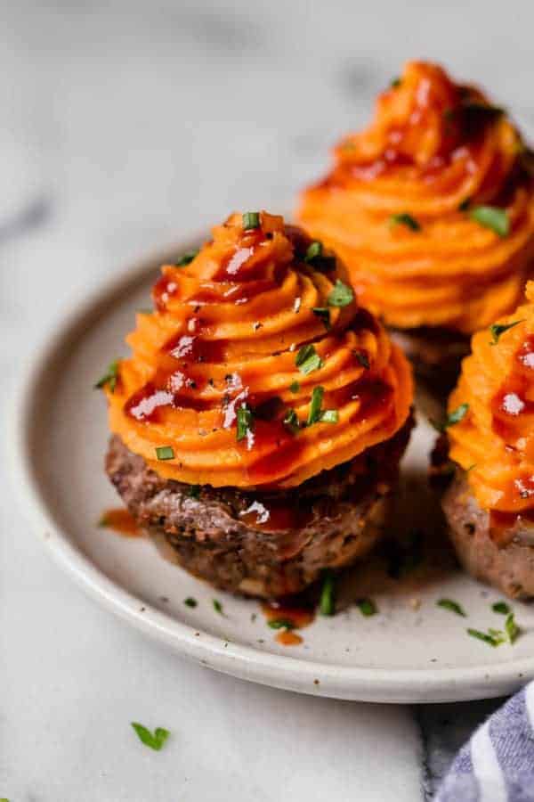 BBQ Meatloaf Muffins with Sweet Potato Topping on a white plate