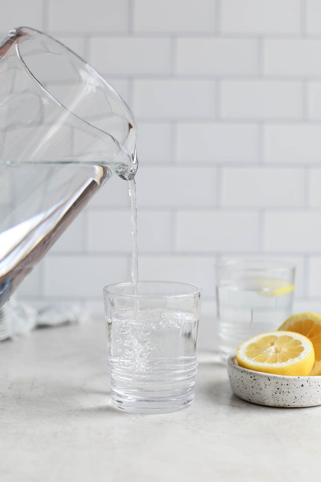 Close up view of water being poured into a glass