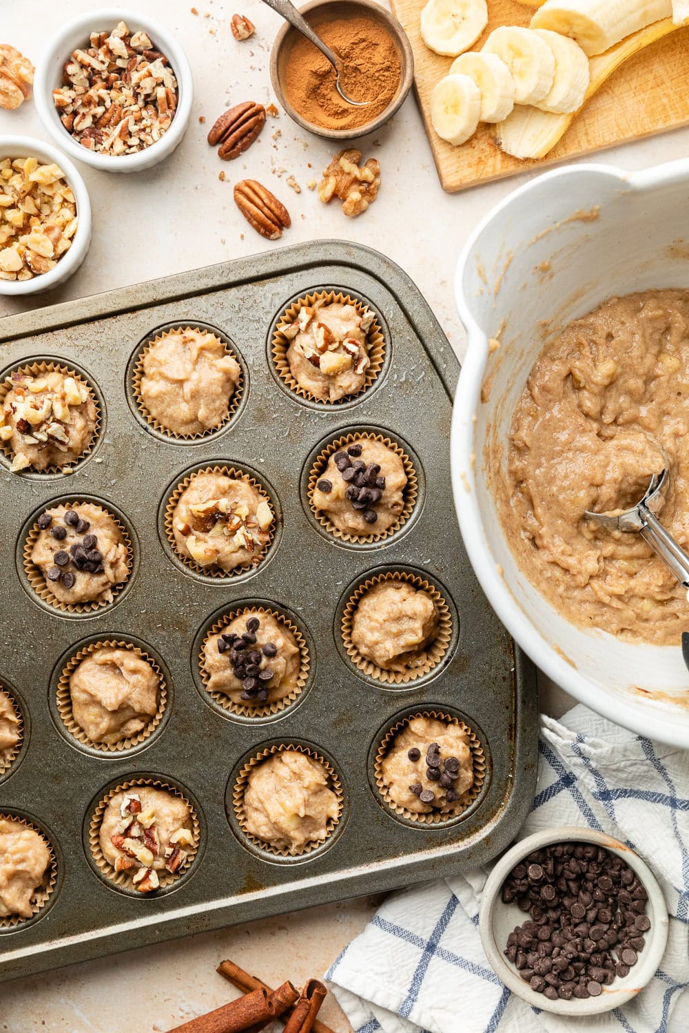 Overhead view of a mini muffin pan filled with batter in each well ready for baking. 