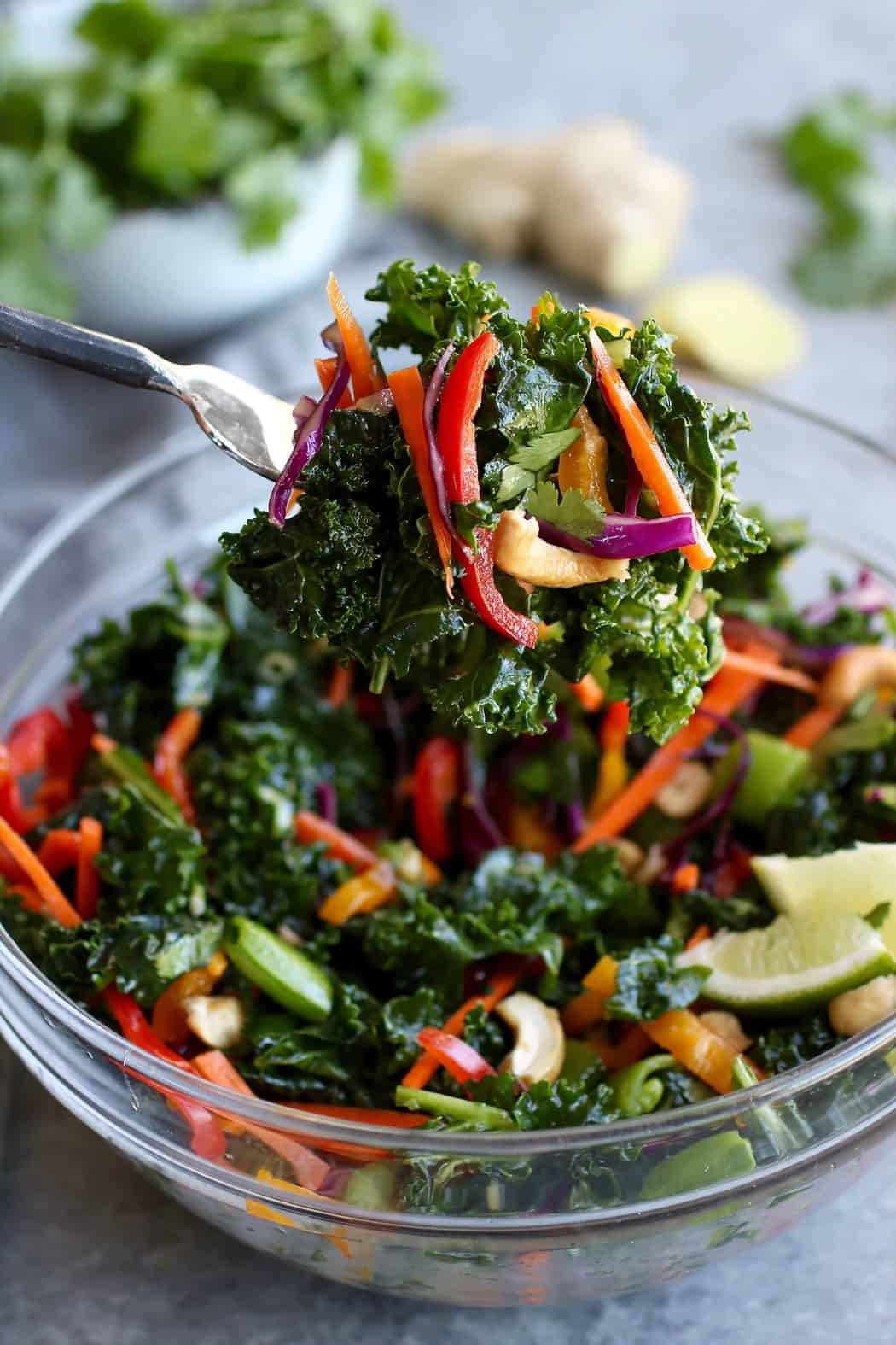 Thai Kale Salad with Cashews on a fork