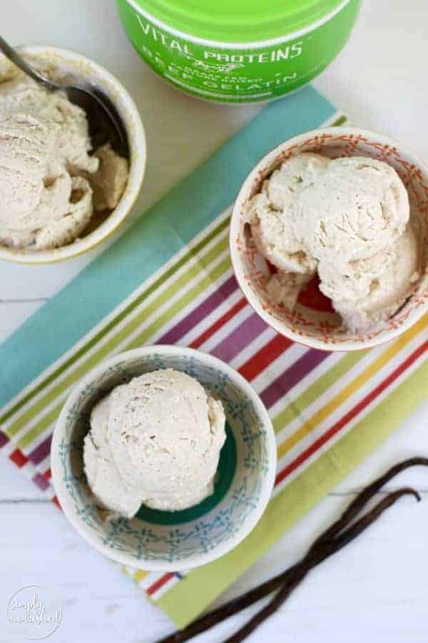 Dairy-free Vanilla Bean Ice Cream in colorful bowls on a striped towel 