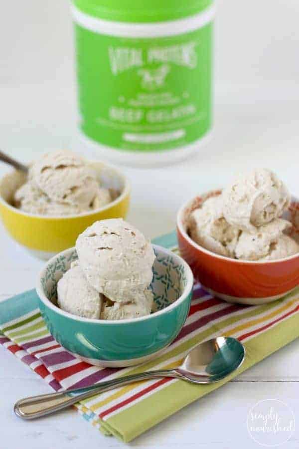 Dairy-free Vanilla Bean Ice Cream in colored bowls on a striped towel