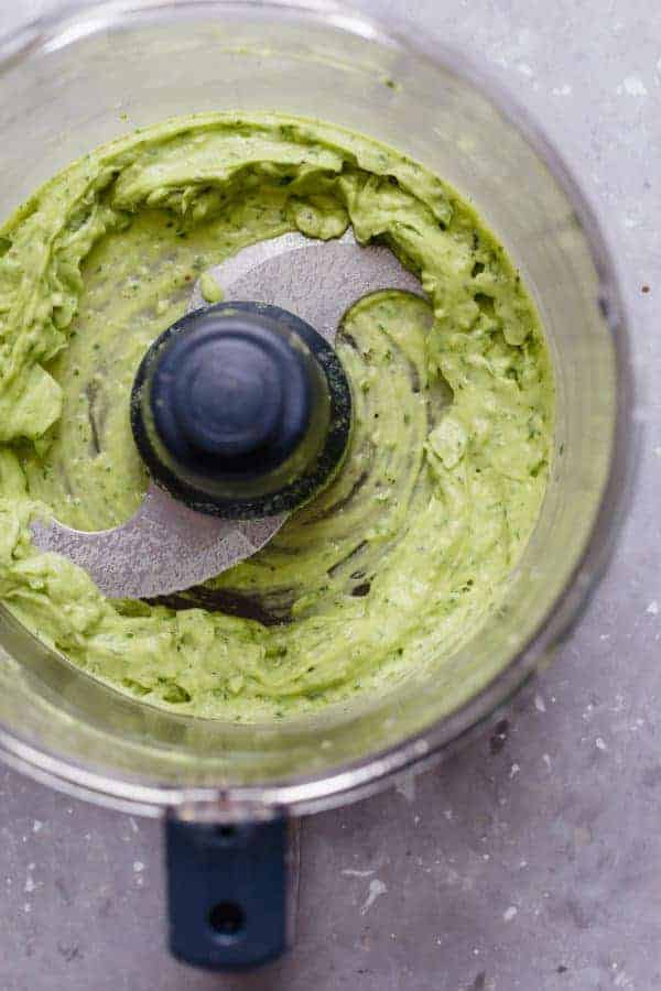 Photo of avocado sauce in a food processor for the Avocado Chicken Waldorf Salad.