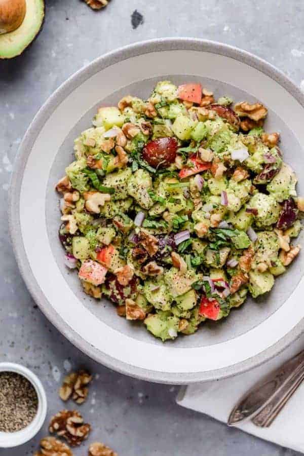 Photo of Avocado Chicken Waldorf Salad on a white plate.