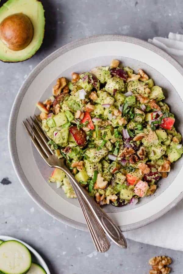 Photo of Avocado Chicken Waldorf Salad on a white plate.