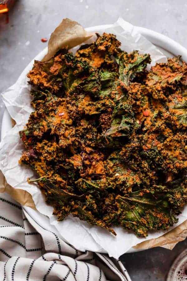 Overhead photo of the Cheese Pizza Kale Chips on a plate. 