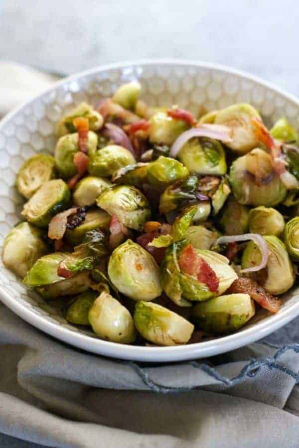 Roasted Brussels Sprouts with Bacon | how to cook brussels sprouts | healthy brussels sprouts recipe | how to roast brussels sprouts | healthy side dish recipes | Whole30 approved recipes | Whole30 side dish recipes | gluten free side dishes | paleo side dishes || The Real Food Dietitians