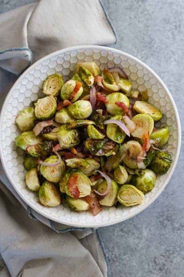 Roasted Brussels Sprouts with Bacon | how to cook brussels sprouts | healthy brussels sprouts recipe | how to roast brussels sprouts | healthy side dish recipes | Whole30 approved recipes | Whole30 side dish recipes | gluten free side dishes | paleo side dishes || The Real Food Dietitians