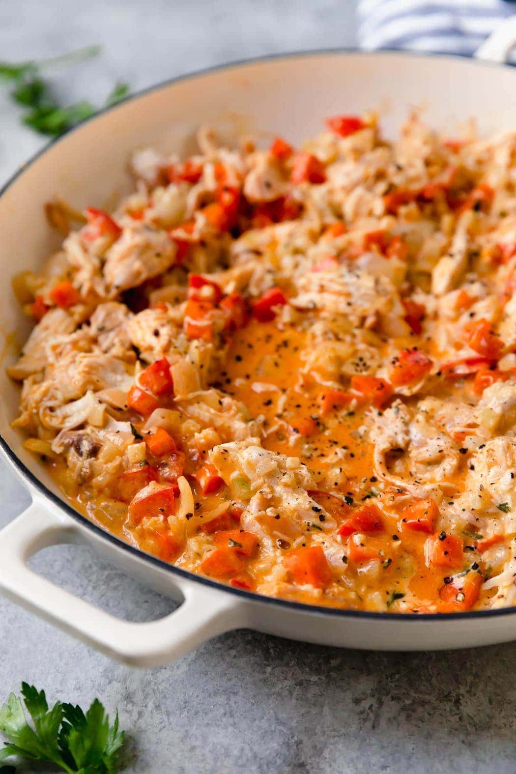 Process shot of Creamy Buffalo Chicken Casserole in white pan