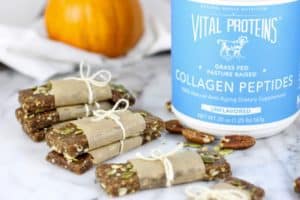 Pumpkin Spice Protein Bars lined on a counter with Vital Proteins Collage Peptides in the background