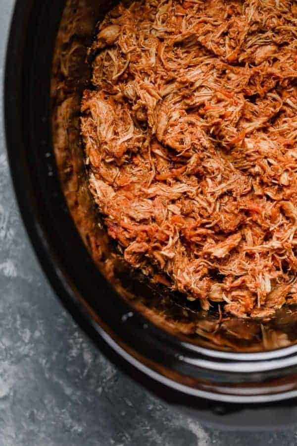 Pulled chicken in a slow cooker for Slow Cooker Chicken Sloppy Joe Sliders