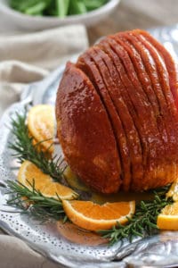 Sliced Orange Glazed Ham on a silver platter