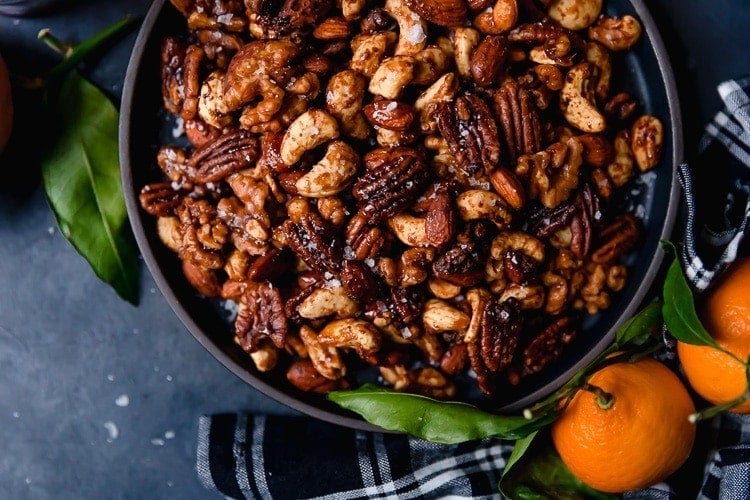 Overhead view black bowl filled with slow cooker spiced nuts