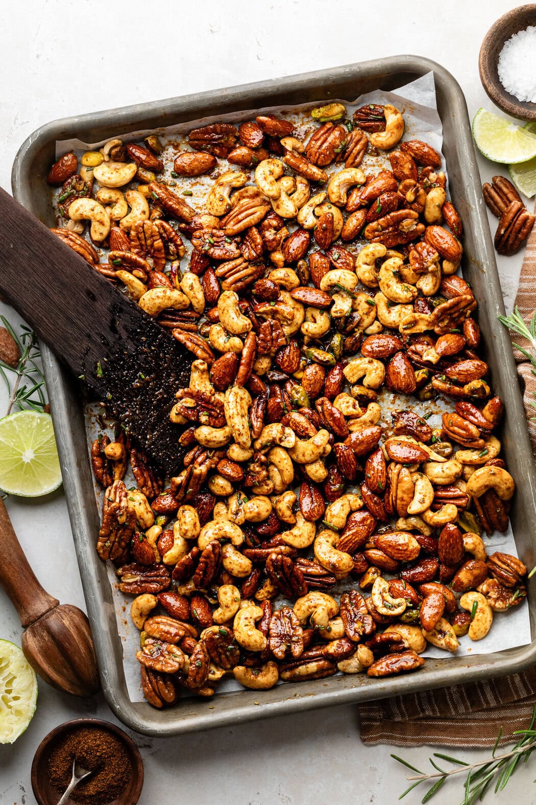 Overhead view of a pan of freshly baked Chili Rosemary Roasted Nuts. 