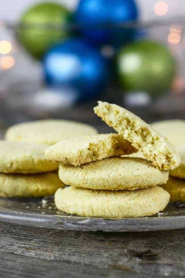 Gluten-Free Lemon-Shortbread Cookies on a glass plate with one broke in half