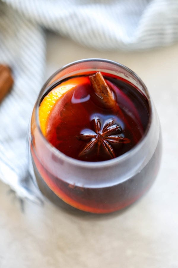 close up shot of crockpot mulled wine with anise and orange