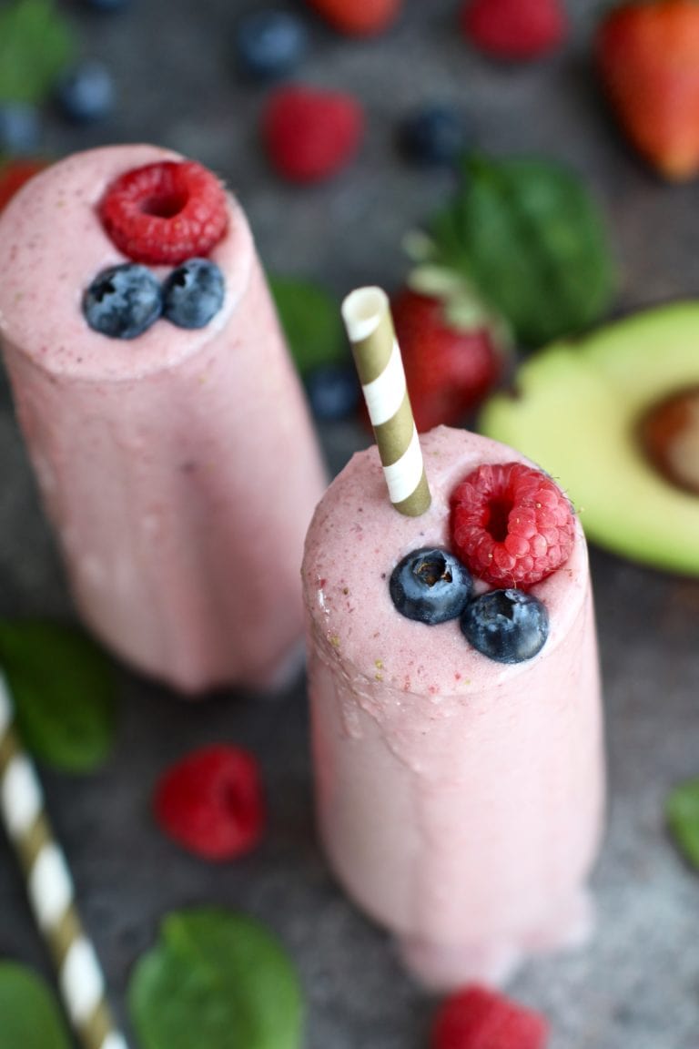 Banana Berry Smoothies topped with fresh berries. 