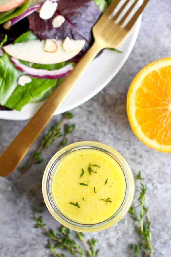 Citrus Vinaigrette with Thyme in a glass jar 
