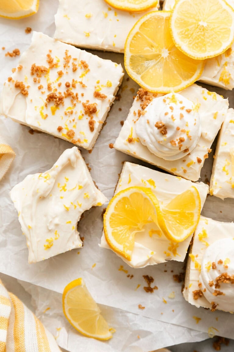 Overhead view of No Bake Lemon Cheesecake Bars topped with lemon zest