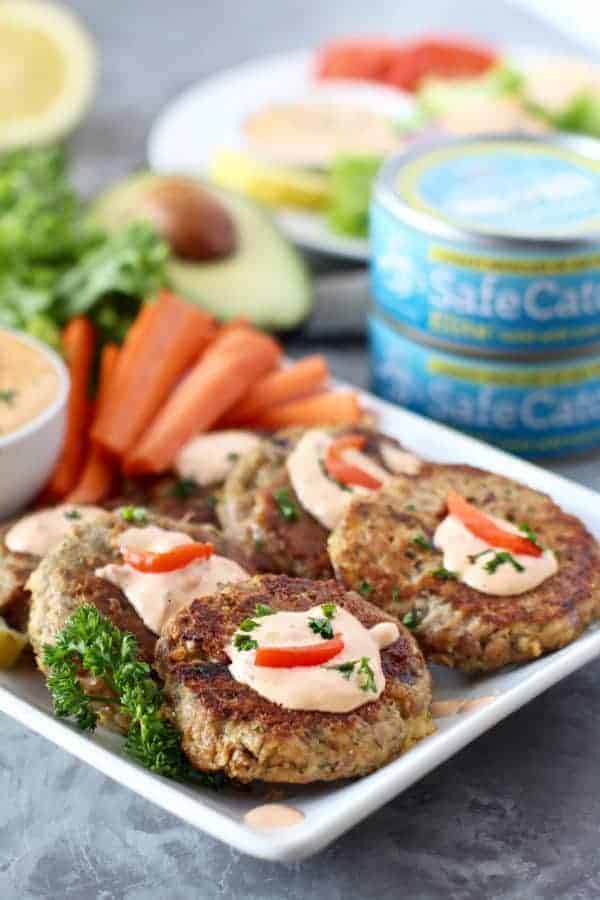Easy Tuna Cakes with Roasted Red Pepper Mayo with side of carrots on a white plate