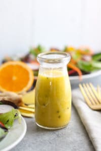 Ginger-Sesame Vinaigrette in glass bottle on gray table