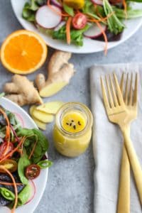 Ginger-Sesame Vinaigrette in glass bottle on gray table