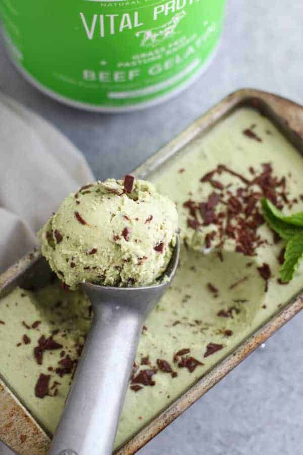 Dairy-free Mint Chocolate Chip Ice Cream on a silver ice cream scooper
