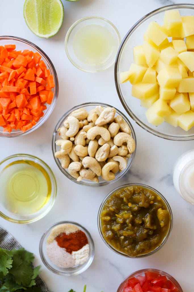 Overhead view of several whole foods ingredients in small bowls. 