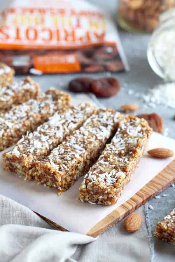 Made in Nature No-Bake Apricot Almond Coconut Energy Bars on a cutting board