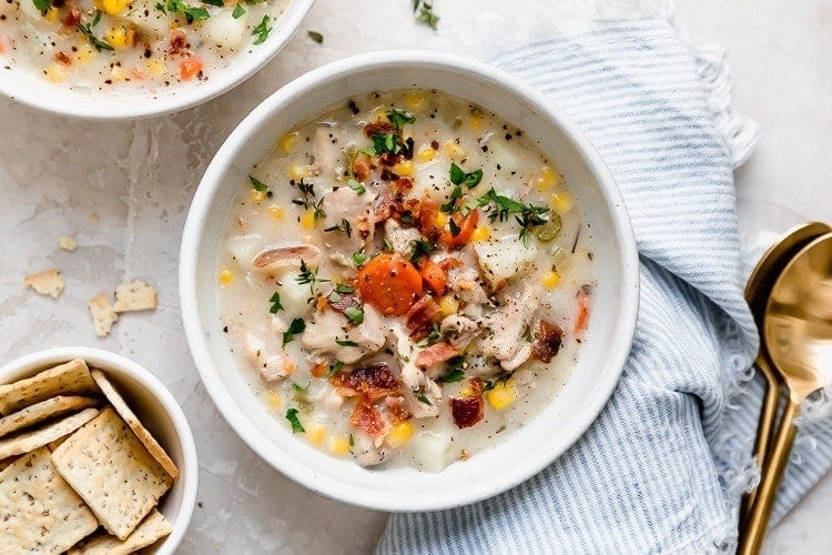 Overhead view white bowl filled with slow cooker chicken corn chowder