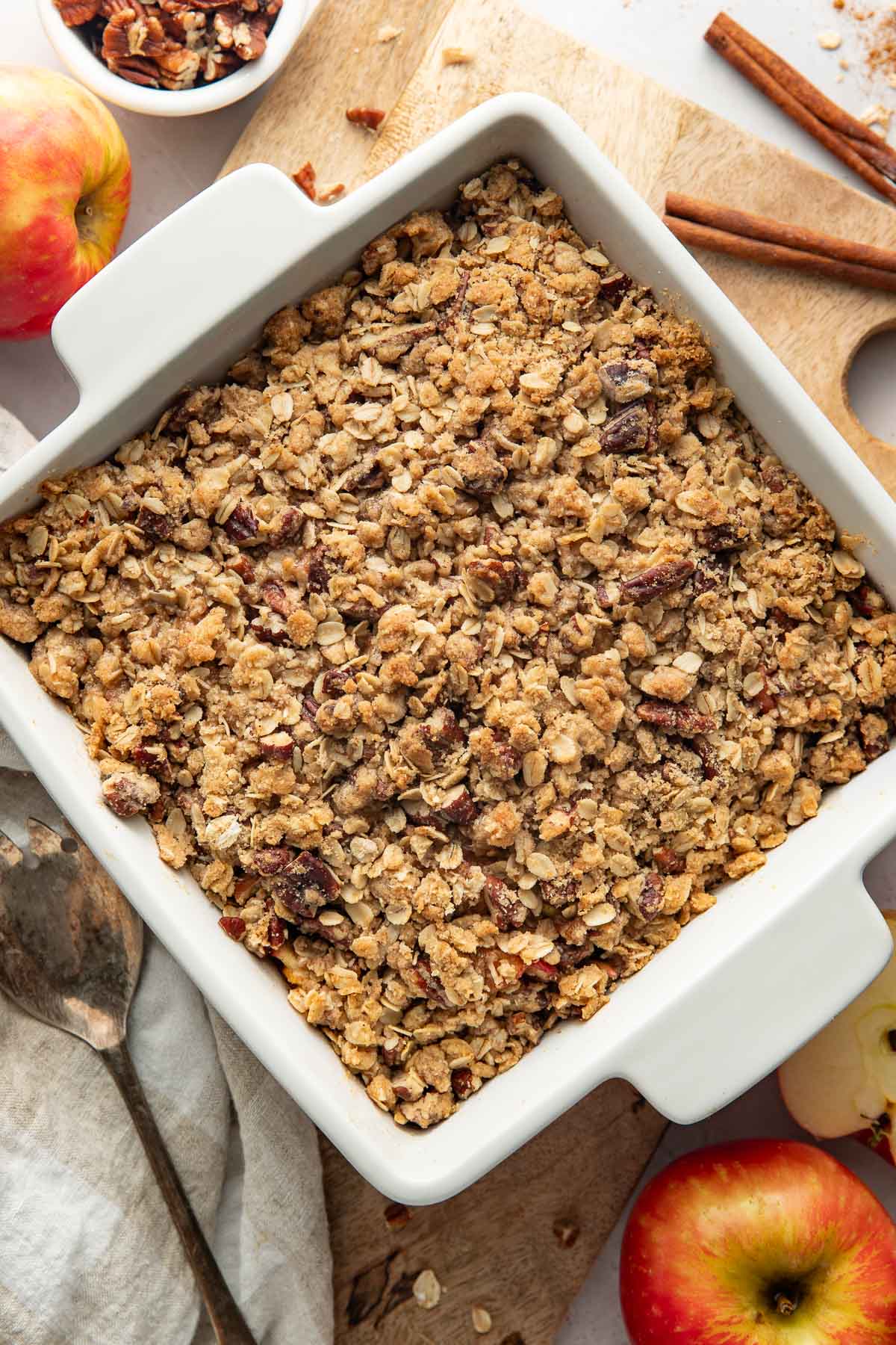 A baked healthy apple crisp in a square baking dish.