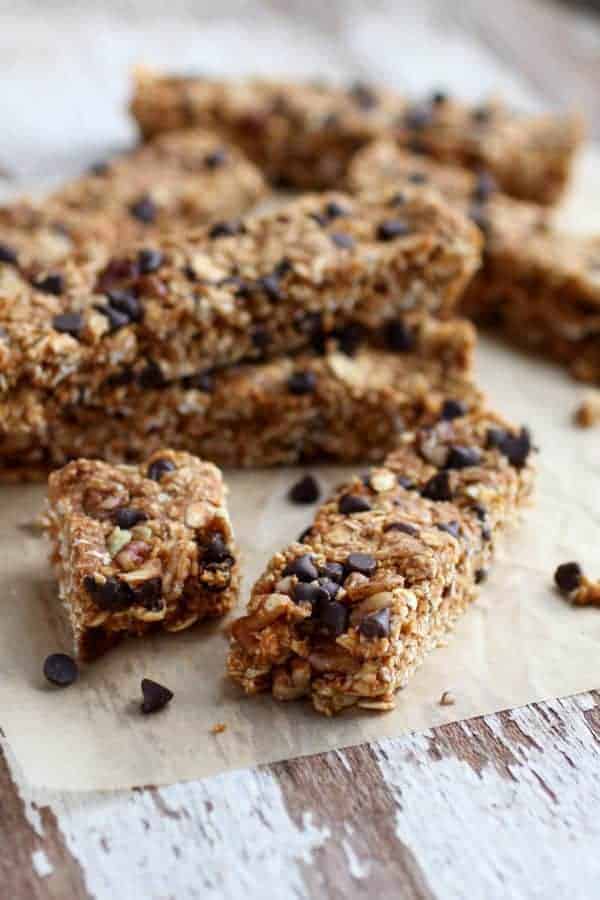 No-Bake Pumpkin Chocolate Chip Granola Bars stacked on a table top 