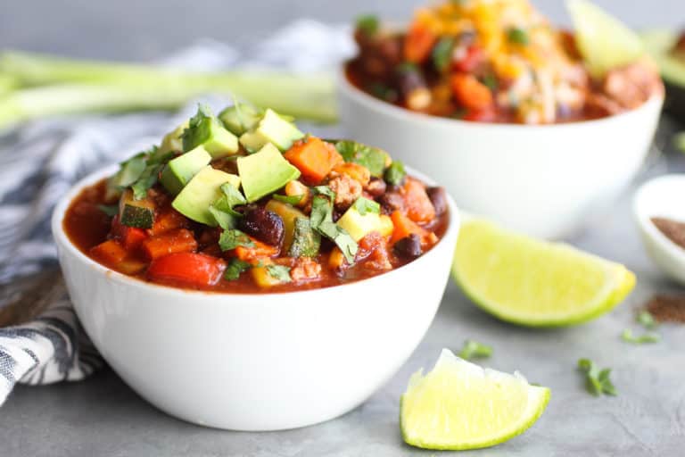 A bowl of veggie loaded turkey chili that can be easily portioned out for meal prep. 