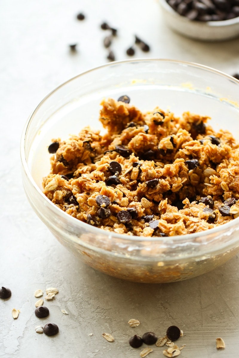 Peanut butter oatmeal cookie dough in a clear glass bowl