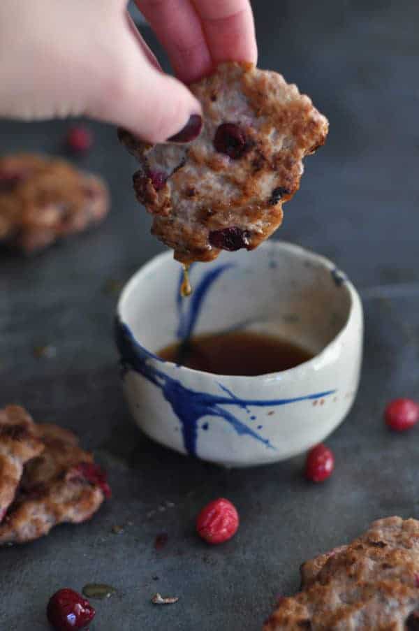 Cranberry Breakfast Sausage Pattie dipped in syrup