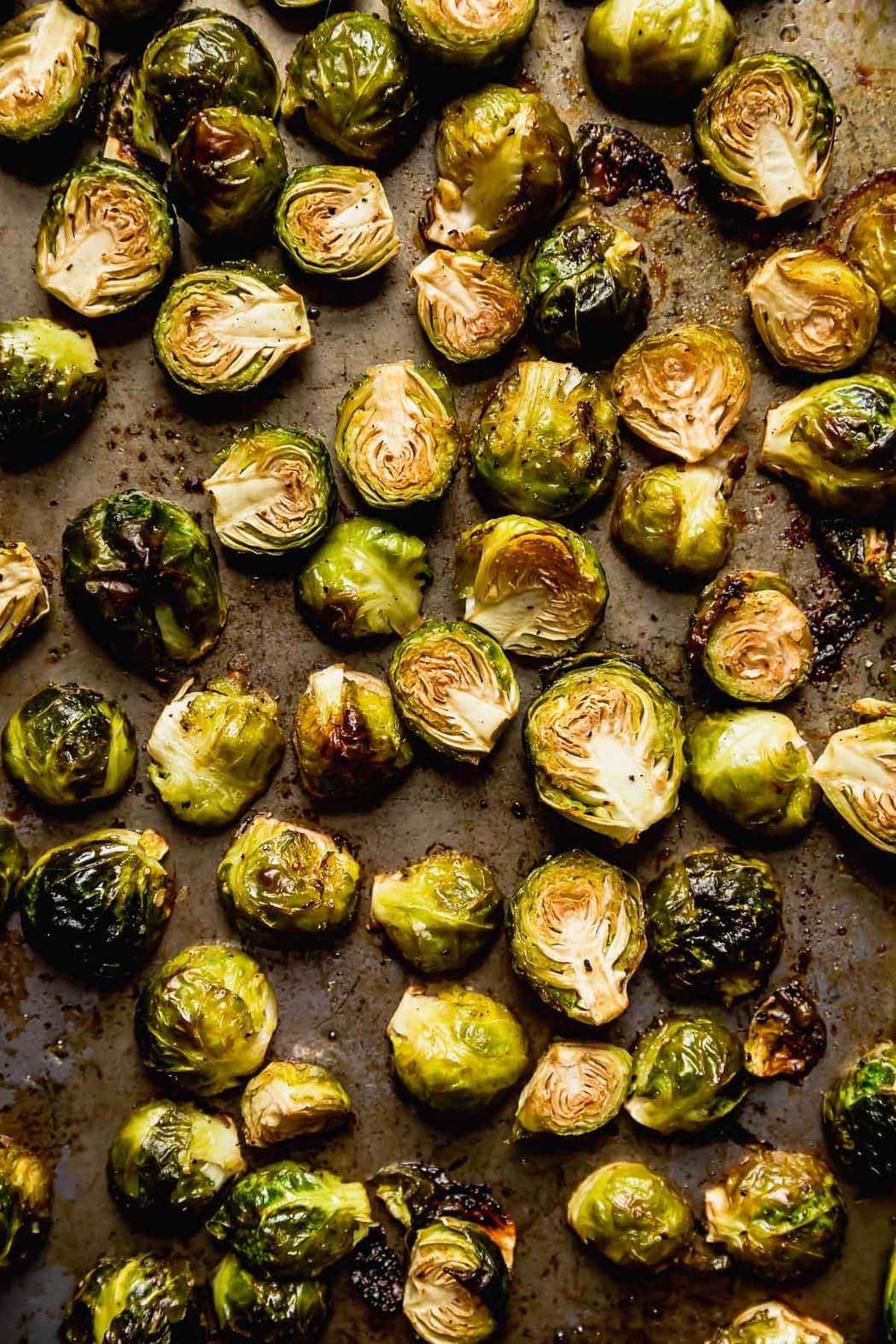 Roasted Brussels Sprouts with Bacon on a pan.