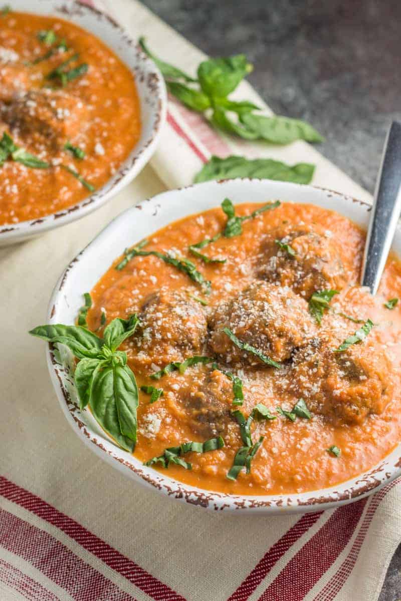 Tomato Basil Bisque with Italian Meatballs from Physical Kitchness | 30 Whole30 Soups, Stews & Chilis | healthy soup recipes | whole30 meal ideas | whole30 recipes | whole30 chili recipes || The Real Food Dietitians #whole30soups #whole30recipe #whole30meals