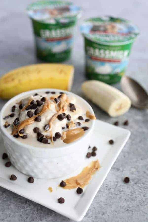 plain yogurt with almond butter and chocolate chips in a ramekin 