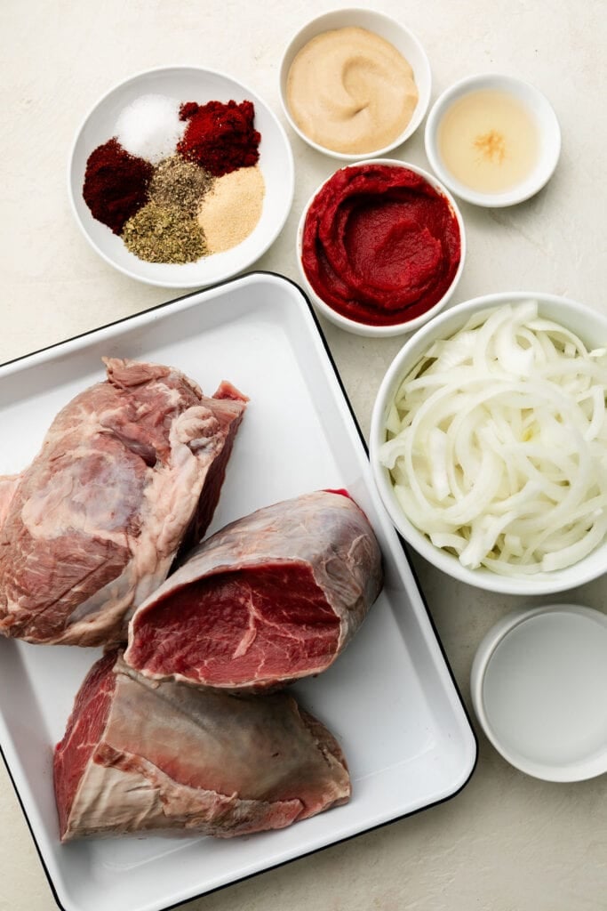 All ingredients for bbq beef arranged in small bowls