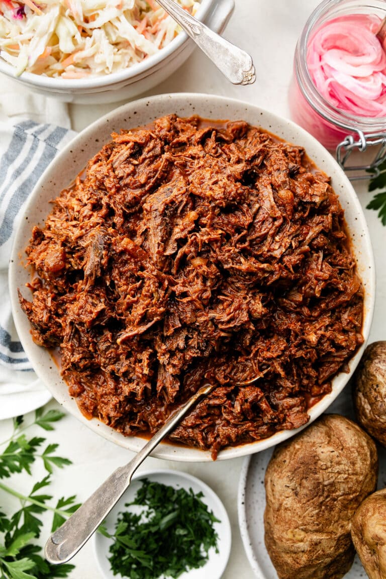 Overhead view stone serving bowl filled with shredded BBQ beef