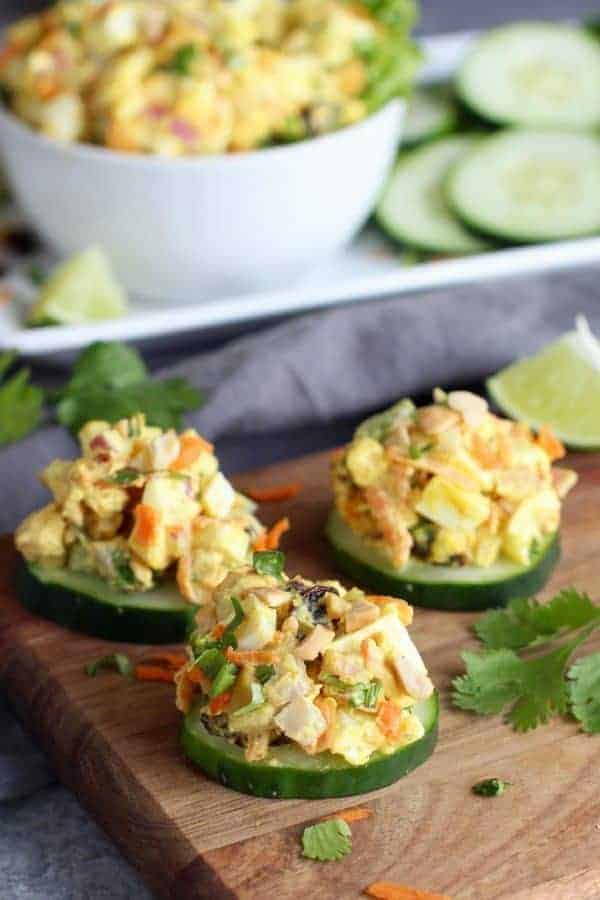 Egg salad topped on cucumber slices. 