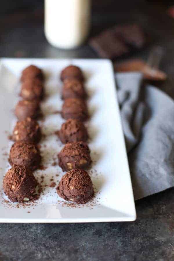 no-bake brownie bites on a white serving tray